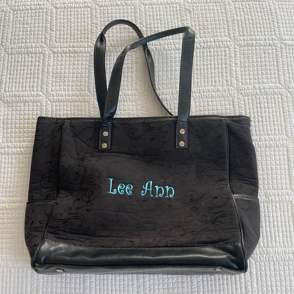 Thirty one Cindy Tote in Black with blue Lee Ann embroidered on it